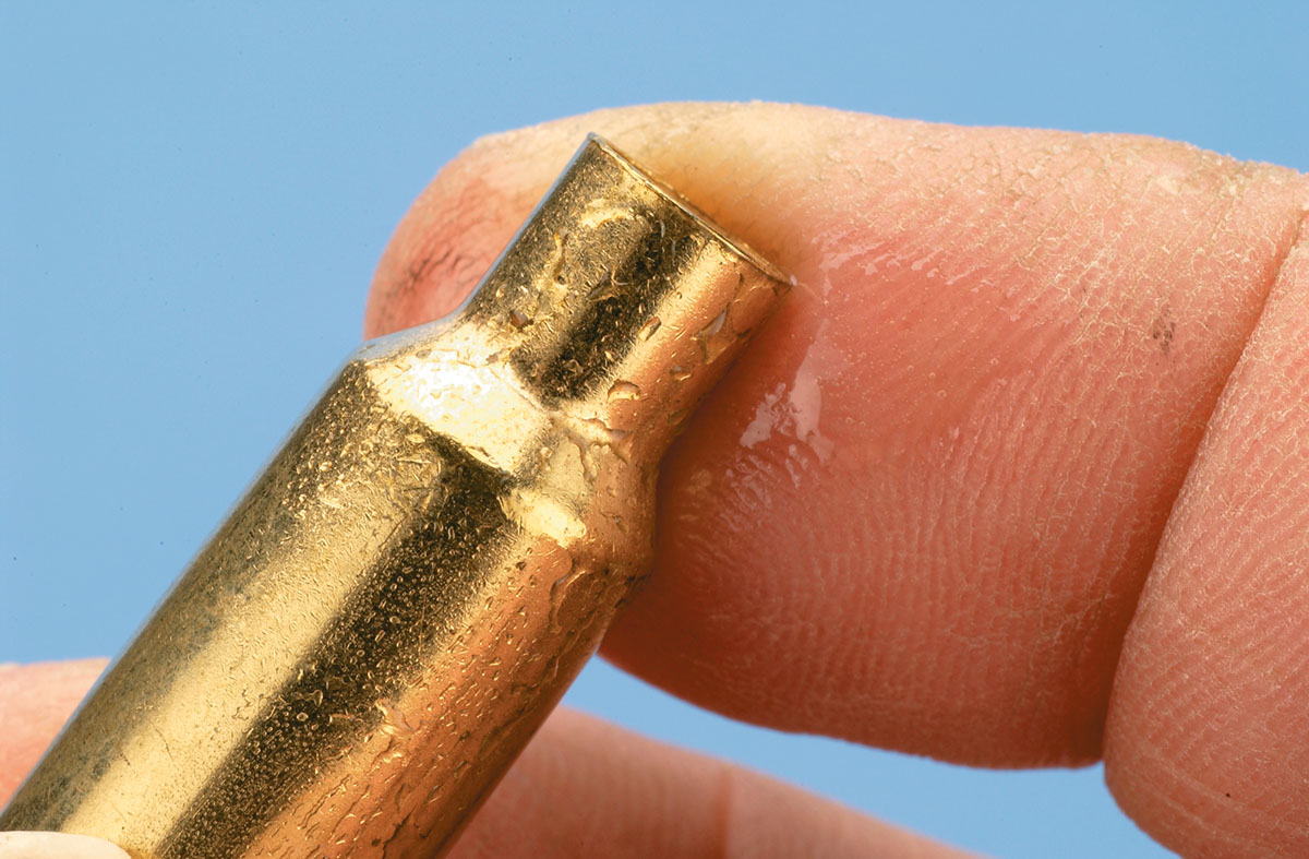 To start the process  of necking down, a small amount of lube is placed on the case neck.